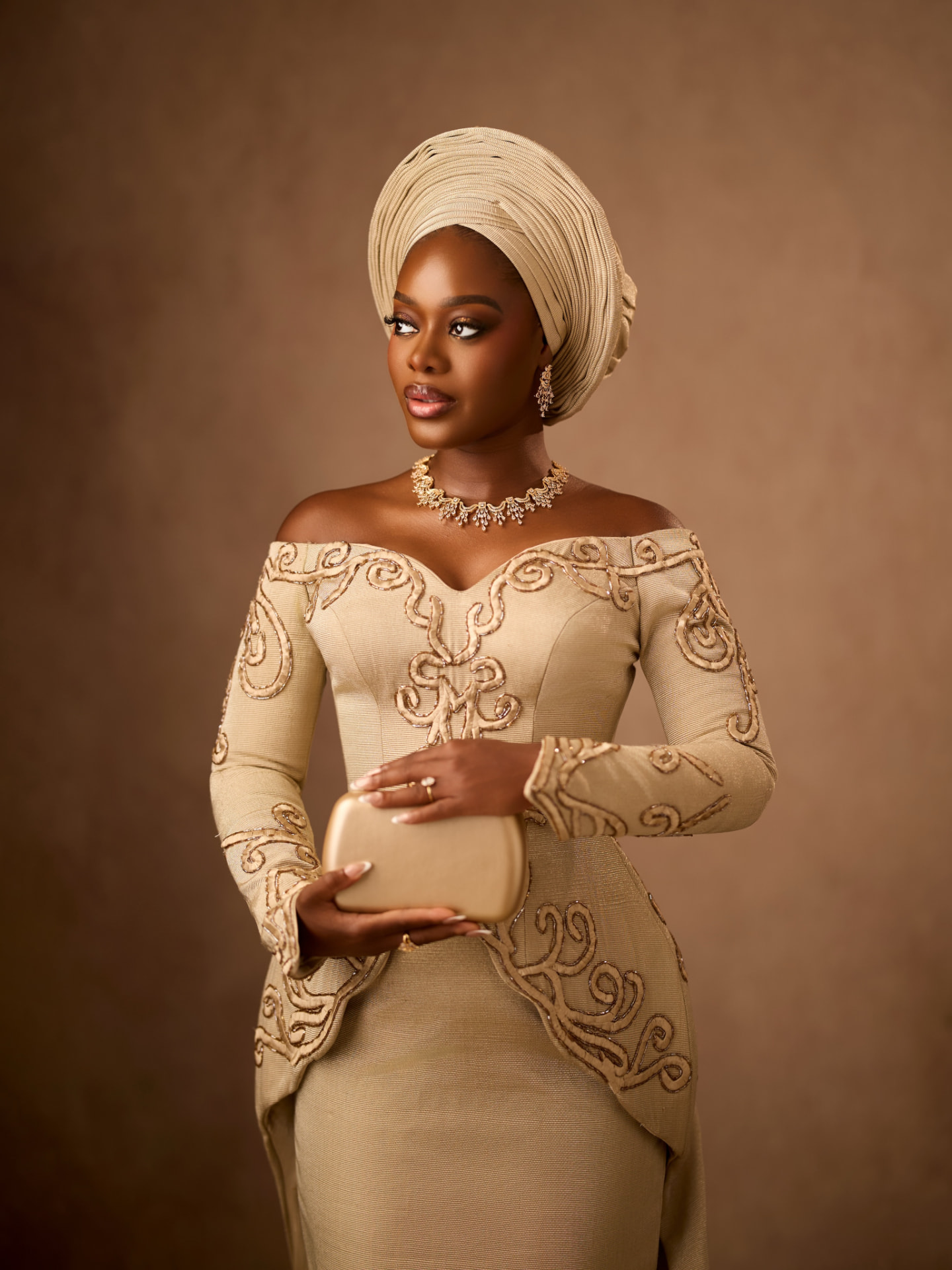 Gold-work bodice and gele